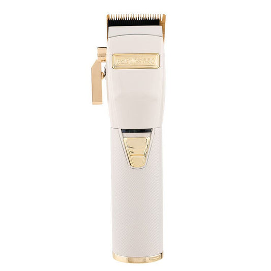 BabylissPRO WhiteFX lithium hair clipper in white with gold blade and accents, front view on white background