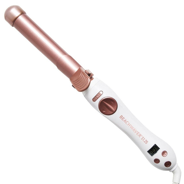 Angled view of Beachwaver S1.25 rose gold ceramic rotating curling iron with digital display