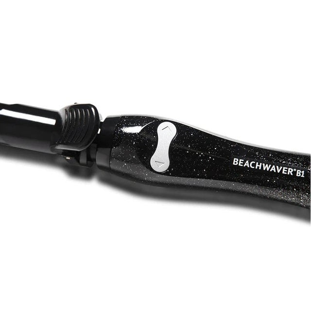 Close-up of Beachwaver S1 black sparkle curling iron handle with rotation control buttons
