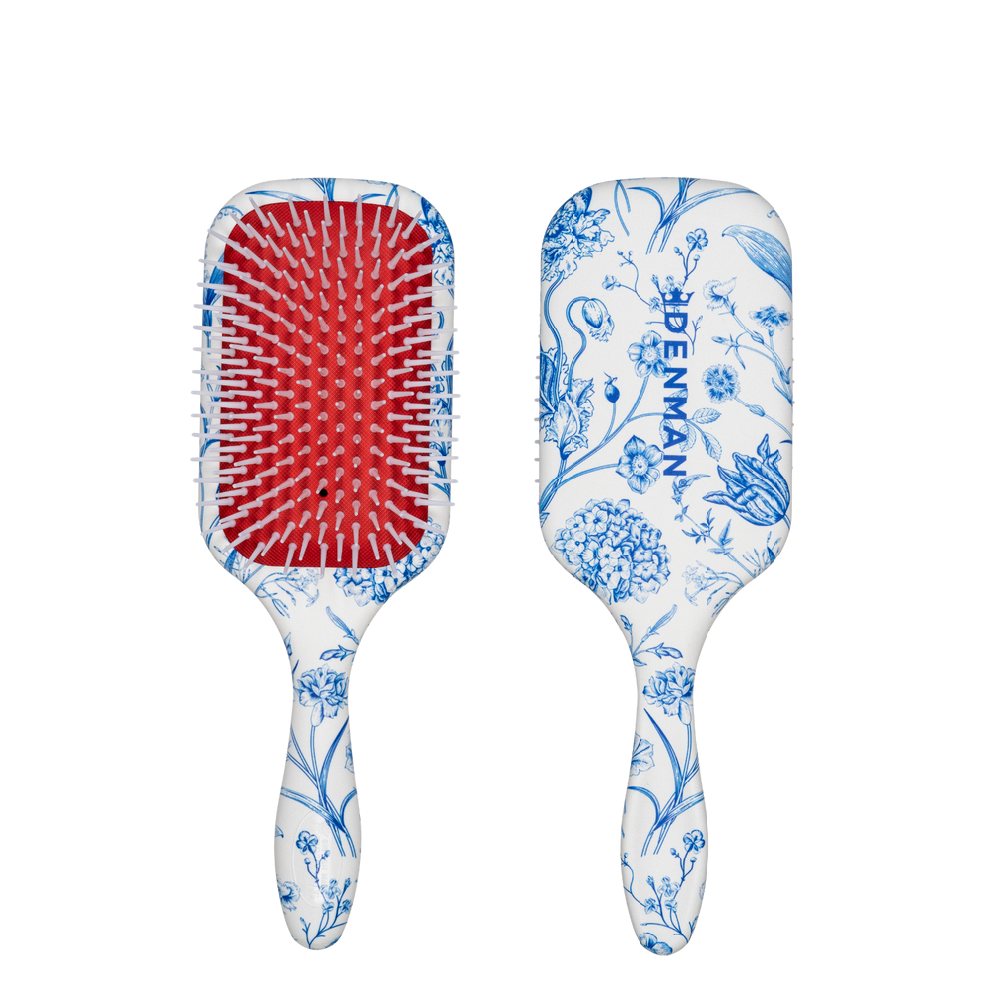 The Denman D38 Power Paddle Brush pairs the grip of classic Denman styling pins with a broad paddle shape, helping you work through more hair with every pass. It delivers controlled tension for smooth, polished results while the Blue Belle print adds a bright finish to your styling kit.
