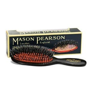 Mason Pearson hairbrush with packaging on a white background