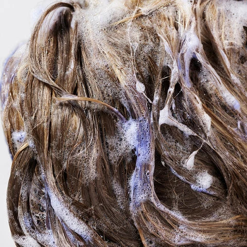 Brighten blonde and silver hair with Oribe Bright Blonde Shampoo for Beautiful Colour. 