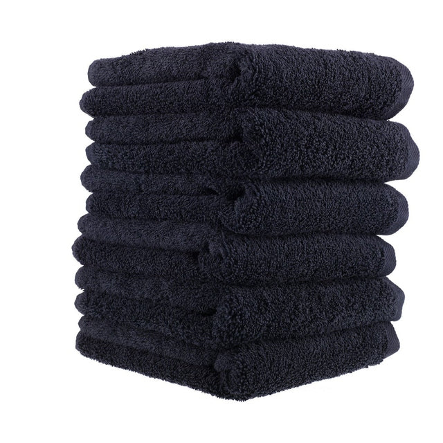 Stack of ten folded deluxe black salon towels made from 100% cotton, 40x70cm