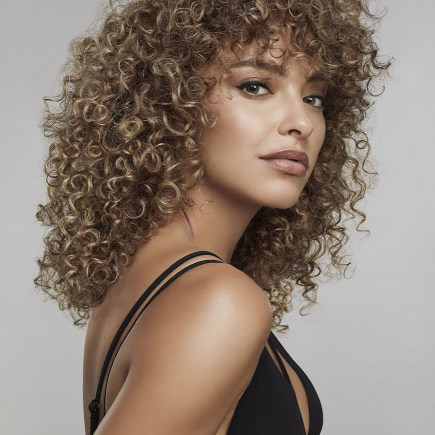 Curly hair styled with diffuser showing defined frizz free curls and natural volume