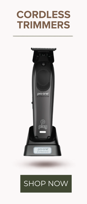 A cordless hair trimmer shown upright on its charging dock against a light gray background, with the text 'CORDLESS TRIMMERS' at the top and a 'SHOP NOW' button at the bottom.
