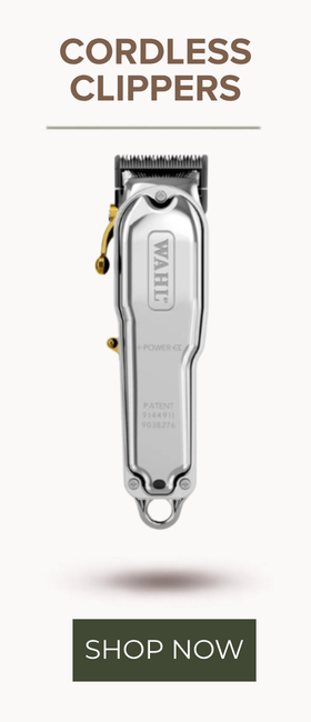A cordless hair clipper shown vertically on a light beige background with the text 'CORDLESS CLIPPERS' at the top and a dark green 'SHOP NOW' button at the bottom. The clipper has a brushed silver body with small gold accents and a black clipper head.