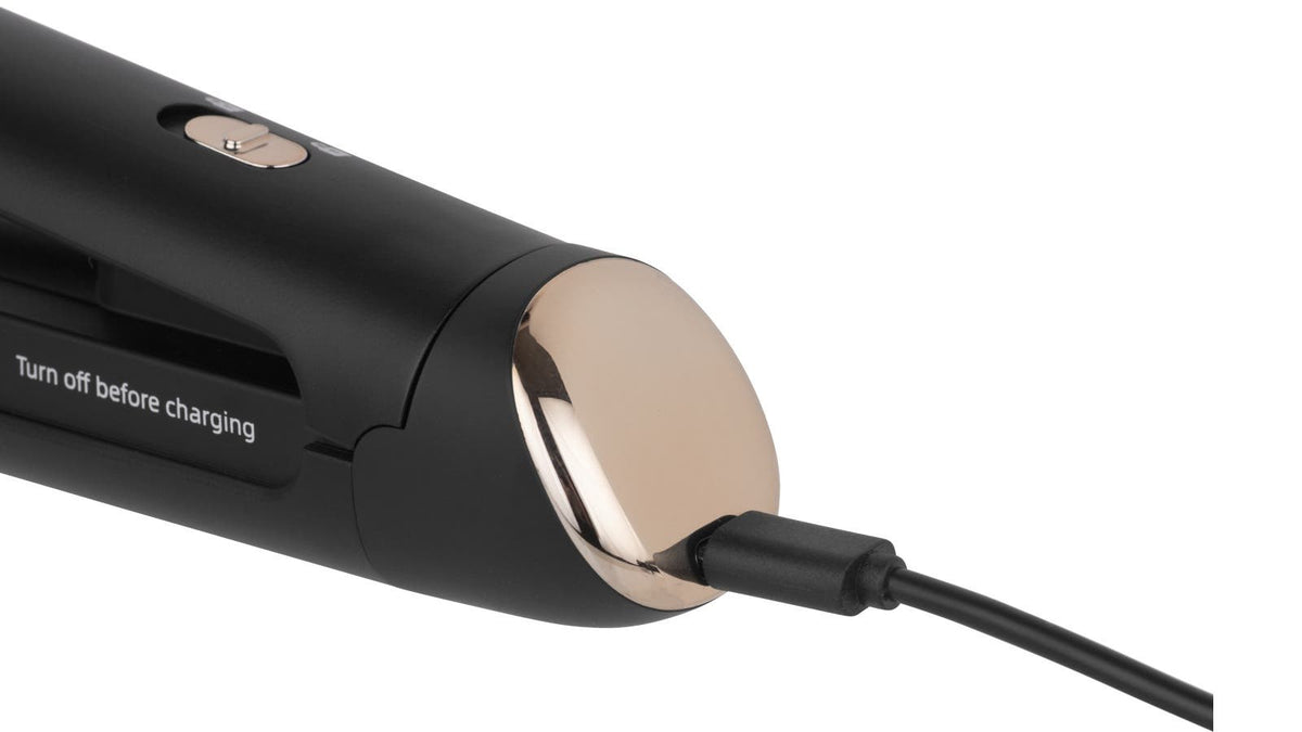 Close-up of Silver Bullet cordless straightener USB cable plugged into metallic end cap