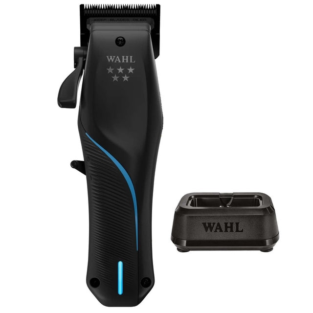 Wahl 5 Star Vapor black cord cordless clipper shown upright beside matching single power station charger