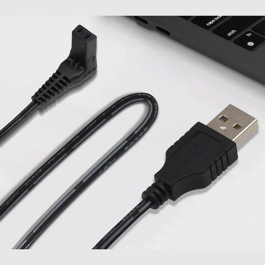 Close-up of Wahl Lithium-Ion USB replacement charging cord plugged into a laptop