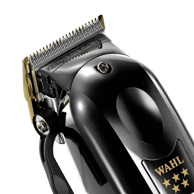 Close-up of Wahl Black Magic Clip cordless clipper showing blade area and side lever