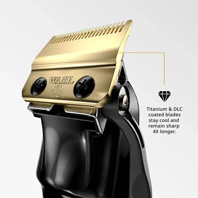 Detail of Wahl Black Magic Clip clipper with gold-colored blade and titanium DLC coating text