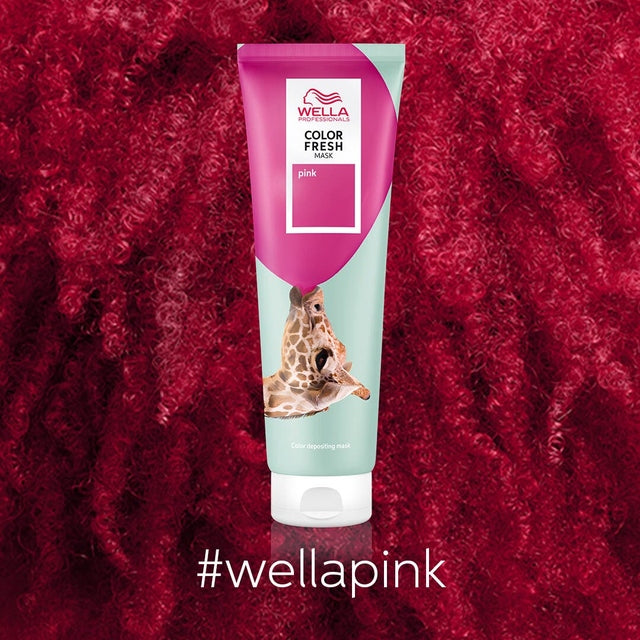 Wella Color Fresh Mask Pink tube on textured pink curls background with hashtag wellapink.